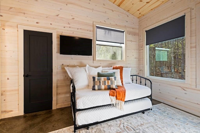 bedroom featuring vaulted ceiling, wood walls, and wooden ceiling