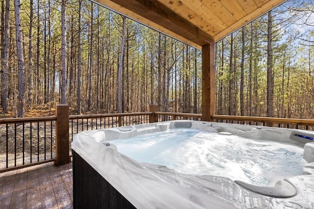 wooden terrace featuring a hot tub