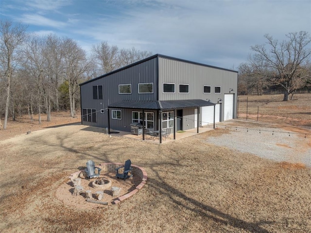 exterior space with an outdoor fire pit