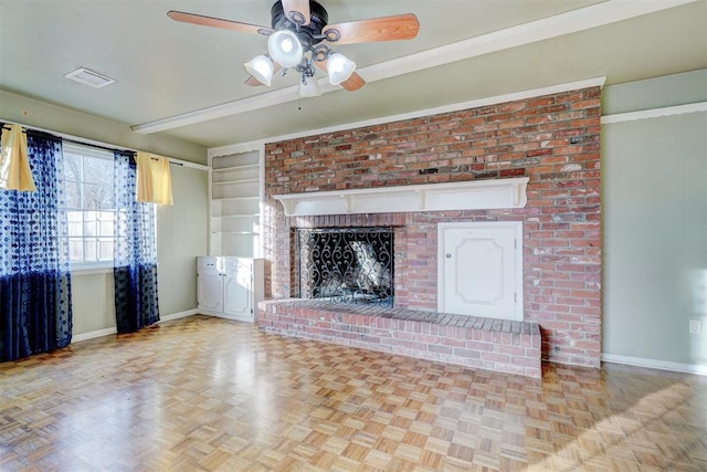 unfurnished living room with light parquet floors, a brick fireplace, built in features, and ceiling fan