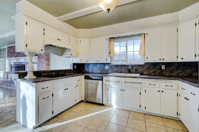 kitchen with dishwasher, sink, and white cabinets