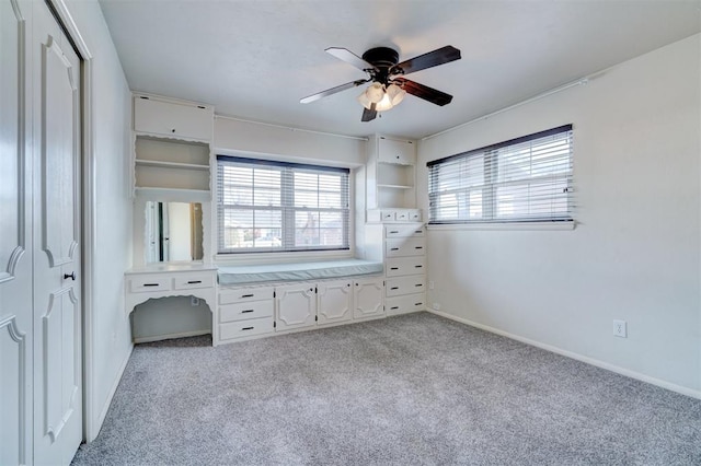 unfurnished bedroom with light carpet and ceiling fan