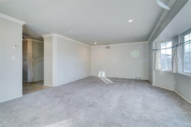 carpeted spare room with crown molding