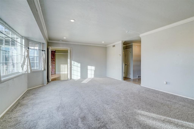 carpeted spare room with ornamental molding