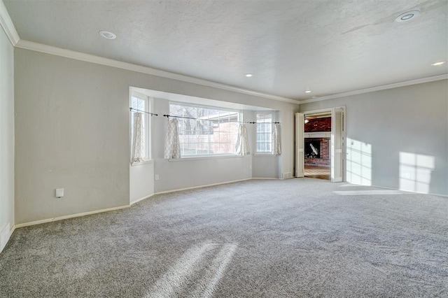 unfurnished living room featuring crown molding, carpet flooring, and a textured ceiling