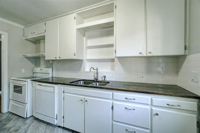 kitchen featuring sink, white cabinetry, light hardwood / wood-style flooring, ornamental molding, and white appliances