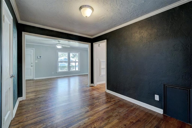 unfurnished room with crown molding, ceiling fan, dark hardwood / wood-style flooring, and a textured ceiling