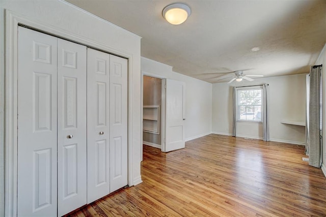 interior space with light hardwood / wood-style flooring and ceiling fan