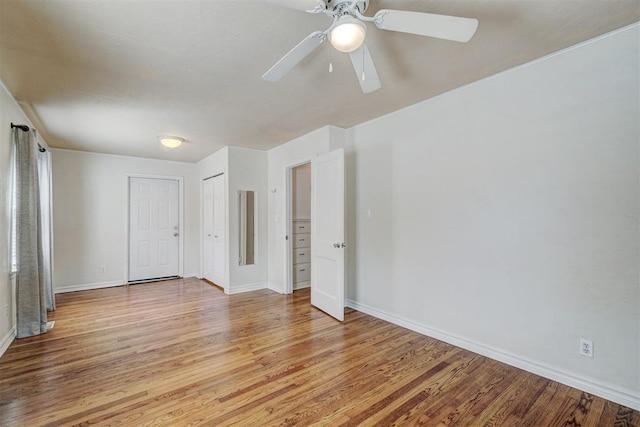 spare room featuring ceiling fan and light hardwood / wood-style flooring