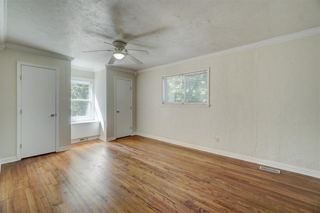 interior space with crown molding, light wood-type flooring, and ceiling fan