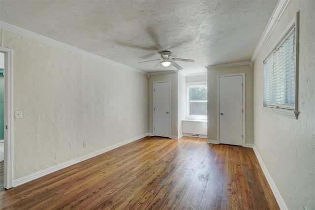 unfurnished room with crown molding, hardwood / wood-style floors, a textured ceiling, and ceiling fan