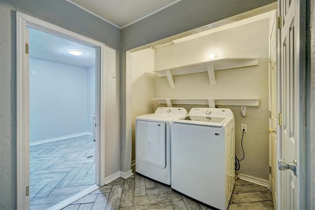 laundry room featuring light parquet floors and washing machine and dryer