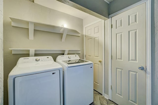 laundry area with independent washer and dryer