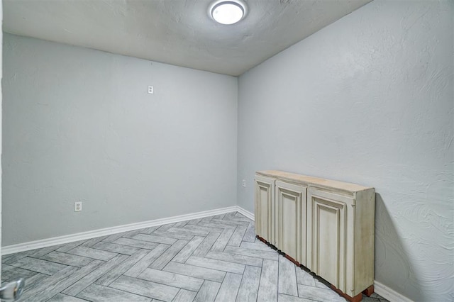 empty room with light parquet floors