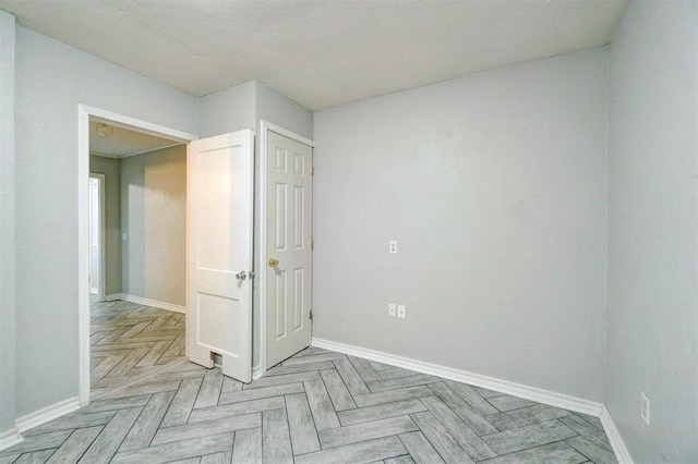 spare room with light parquet floors