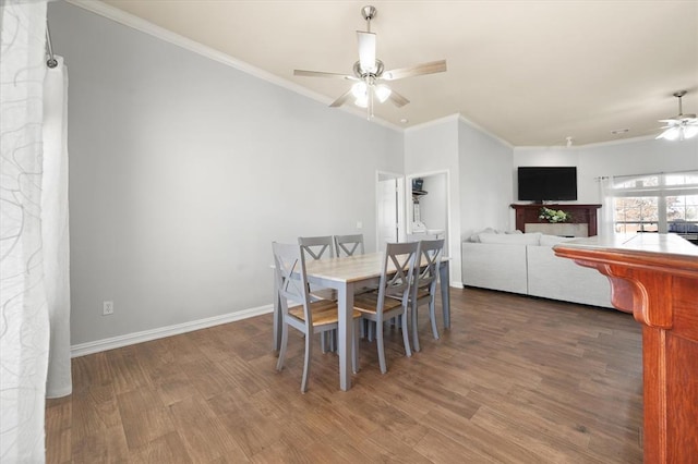 dining room featuring hardwood / wood-style flooring, crown molding, and ceiling fan