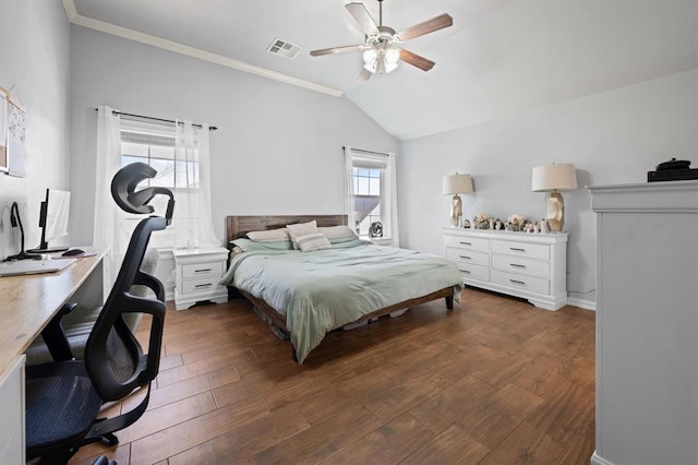 bedroom featuring crown molding, lofted ceiling, dark hardwood / wood-style floors, and ceiling fan