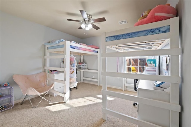 bedroom with ceiling fan and carpet