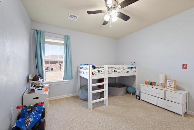 bedroom featuring light colored carpet and ceiling fan