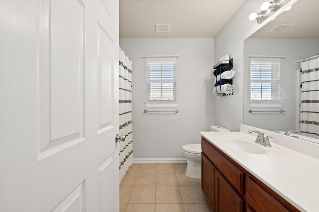 bathroom with vanity, tile patterned floors, and toilet