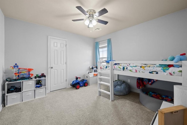 carpeted bedroom featuring ceiling fan