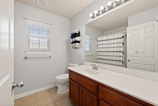 bathroom with tile patterned flooring, vanity, a shower with curtain, and toilet