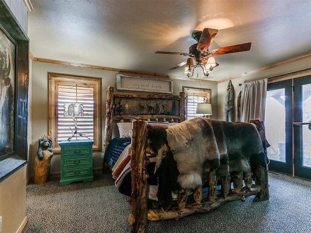 bedroom with ceiling fan, access to exterior, ornamental molding, and carpet floors