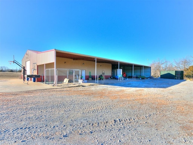 view of front of home featuring an outbuilding