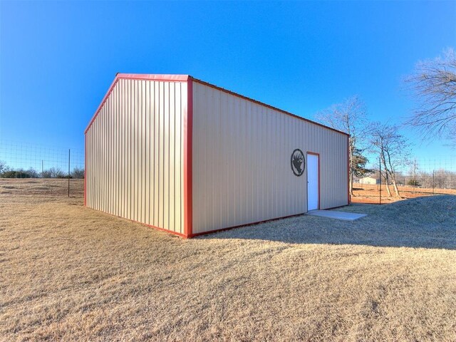 view of outbuilding with a yard