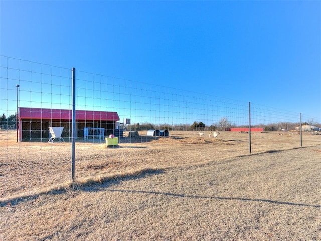 view of yard with a rural view