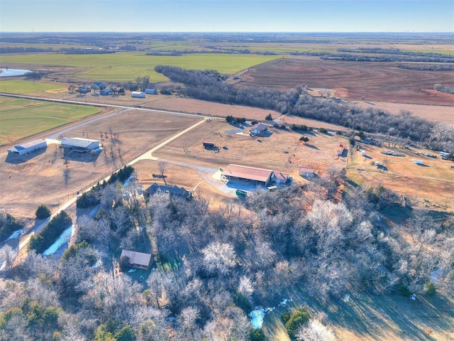 birds eye view of property with a rural view