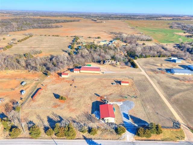 birds eye view of property featuring a rural view