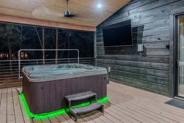 wooden deck featuring a hot tub