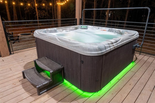 wooden terrace with a hot tub