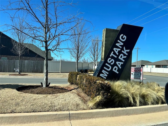 view of home's community with fence