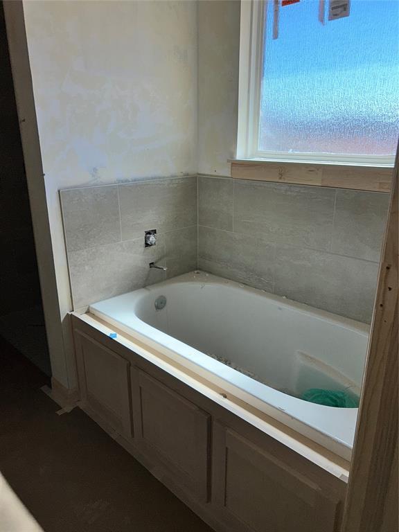 bathroom featuring a garden tub