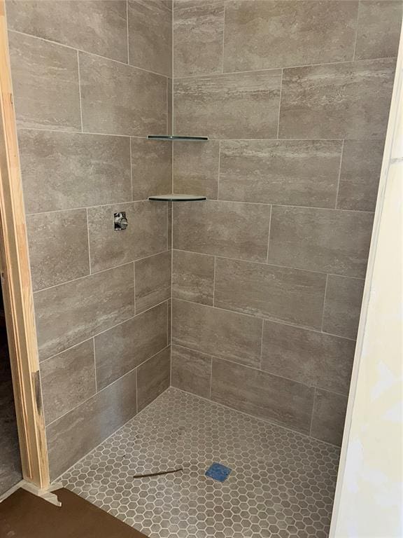 bathroom with tiled shower