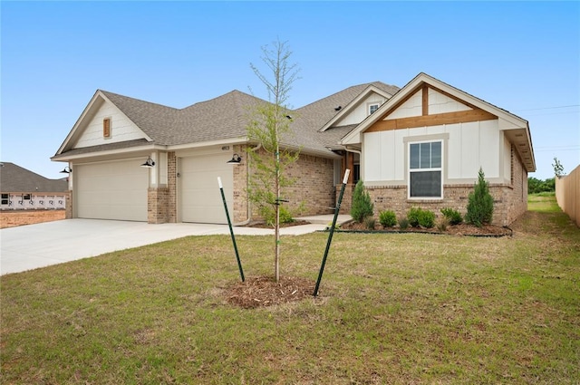 4813 Mistywood Ln, Mustang, OK 73064 - craftsman house with a garage, concrete driveway, brick siding, a front yard, and board and batten siding