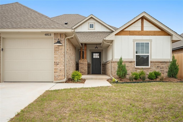 4813 Mistywood Ln, Mustang, OK 73064 - view of front of property featuring an attached garage, driveway, board and batten siding, a front lawn, and roof with shingles