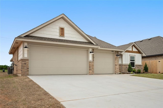 4813 Mistywood Ln, Mustang, OK 73064 - view of front of property featuring brick siding, an attached garage, driveway, a shingled roof, and central AC unit