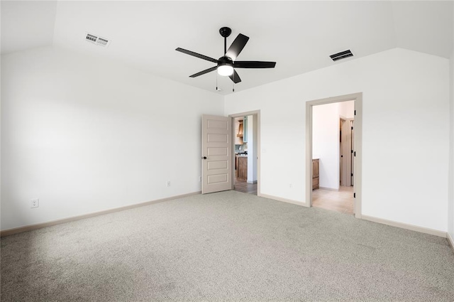 4813 Mistywood Ln, Mustang, OK 73064 - unfurnished bedroom with vaulted ceiling, light colored carpet, baseboards, and a ceiling fan
