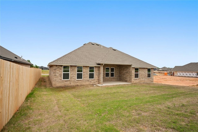 4813 Mistywood Ln, Mustang, OK 73064 - back of house with a patio, brick siding, and roof with shingles