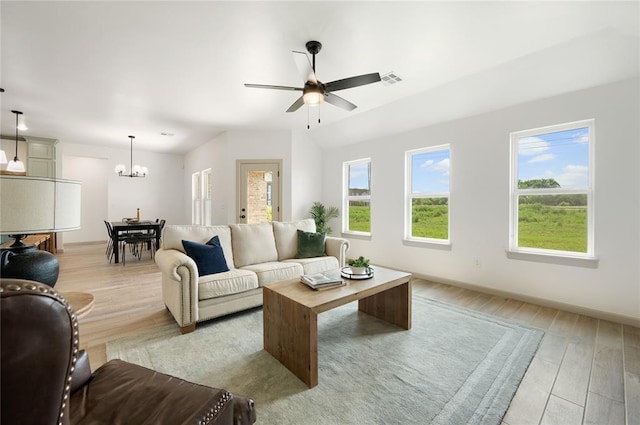 4813 Mistywood Ln, Mustang, OK 73064 - living room featuring light wood-type flooring, a chandelier, and ceiling fan