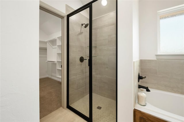 4813 Mistywood Ln, Mustang, OK 73064 - full bathroom featuring a garden tub, a stall shower, and a walk in closet