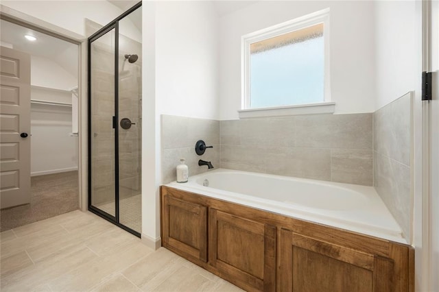 4813 Mistywood Ln, Mustang, OK 73064 - full bathroom featuring a garden tub, a stall shower, and a walk in closet