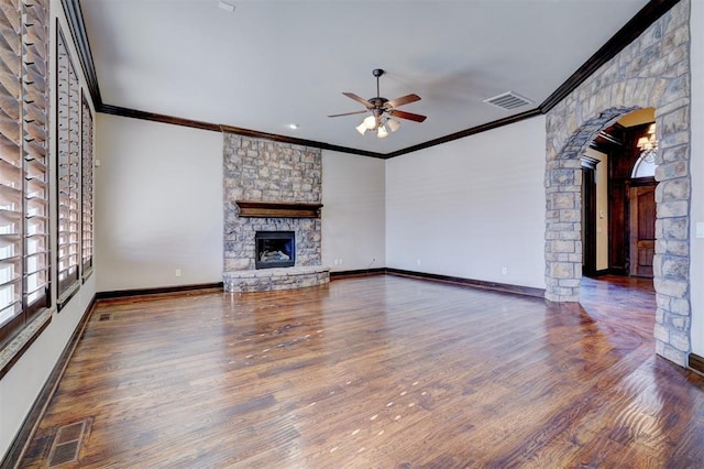 unfurnished living room featuring a fireplace, dark hardwood / wood-style floors, and ornamental molding