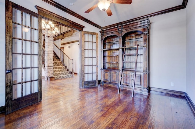 unfurnished office with hardwood / wood-style floors, french doors, ceiling fan with notable chandelier, and ornamental molding