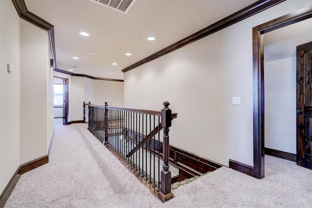 interior space featuring crown molding and carpet floors