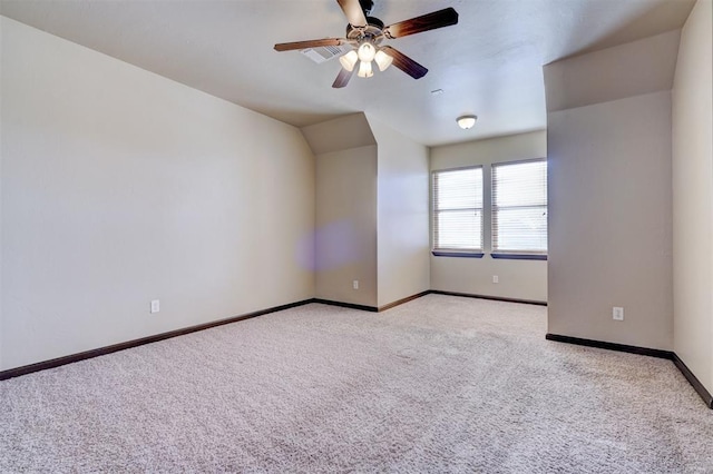 bonus room featuring light carpet and ceiling fan