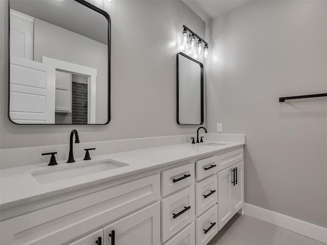 bathroom with tile patterned floors and vanity